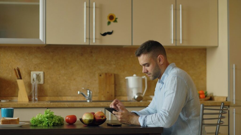fit person preparing healthy snack in modern kitchen with natural light